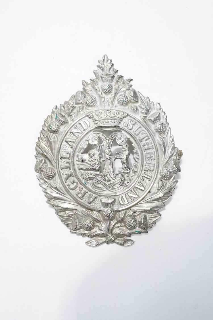 A First World War medal trio awarded to 2140 SJT. G. Watson. Argyll and Sutherland Highlanders, together with the related cap badge and two photographs of Watson in Highlanders uniform and printed as postcards